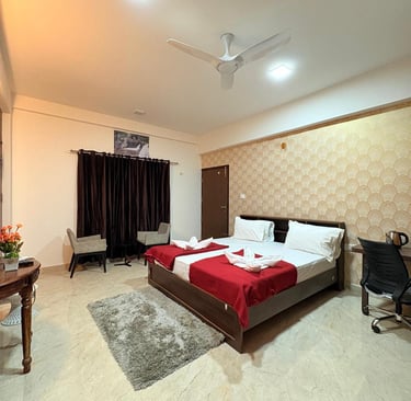 a bedroom with a bed and a desk