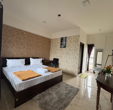 a bedroom with a bed and a desk