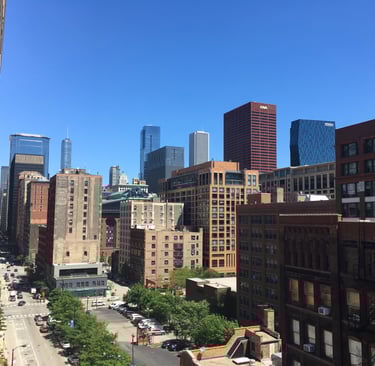High-angle view of the Chicago skyline with commercial and residential buildings.