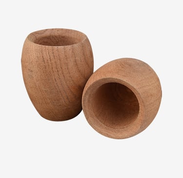 Two small hand-carved natural wooden cups with visible grain on a white background.