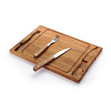 Wooden carving board with a stainless steel steak knife and fork set on a white background.