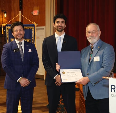 Kyle Gutshall receiving Paul Harris Fellow Award at the Woodstock Rotary's 100th Anniversary Dinner