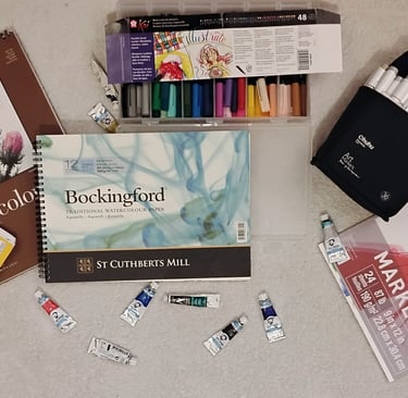 An image of different types of art paper and mediums