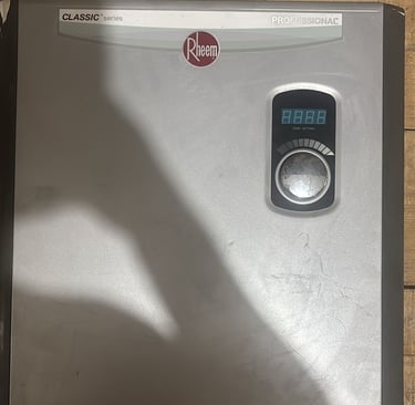 a silver and silver colored electric water heater