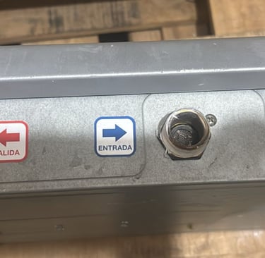 a person holding a metal box with a blue arrow