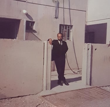 Ravinder Vashisht in front of completed house