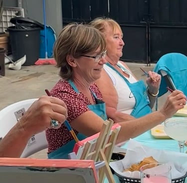 Guests enjoying a paint and sip in Cozumel Mexico