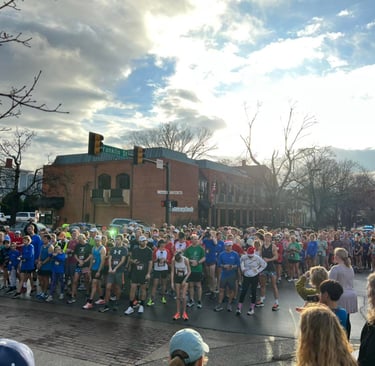 Runners lined up for the start of the Trax 4 Max Turkey Trot in Downtown Florence Alabama