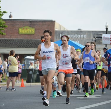 Runners Sprint Away from the starting line of the Athens Alabama Chick Fil A 10K Race