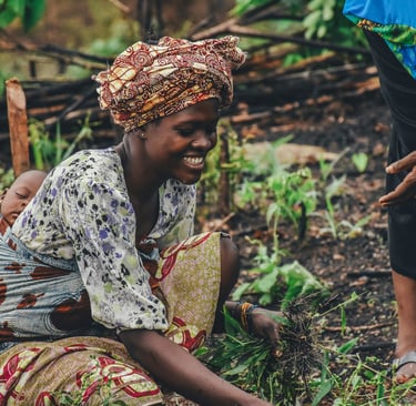 Lady farming with baby