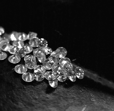 a bunch of CVD Lab-Grown Diamonds on a black and white background