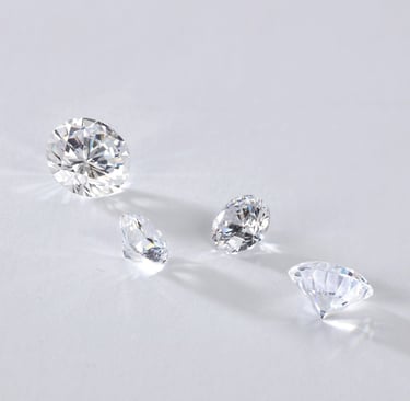 a group of three lab grown diamonds