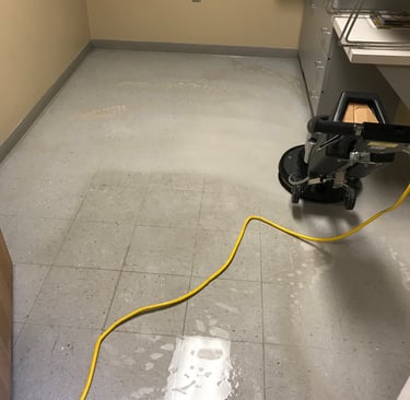 "Tile Stripping in a medical office in Ormond Beach, FL by TEC Floor Services."