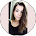 a woman with long hair and a black top