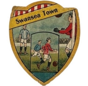 Vintage Swansea Town football crest featuring players in action on a shield-shaped badge.