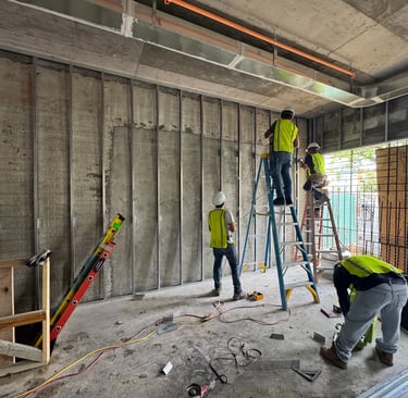 Light-gauge steel stud framing installation in a Washington DC commercial building interior
