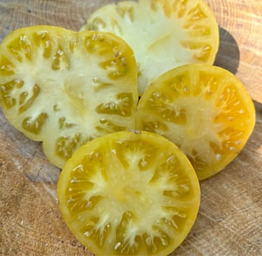 PINEAPPLE PIG | Large, juicy beefsteak fruits with striking yellow skin marbled with pink blushes