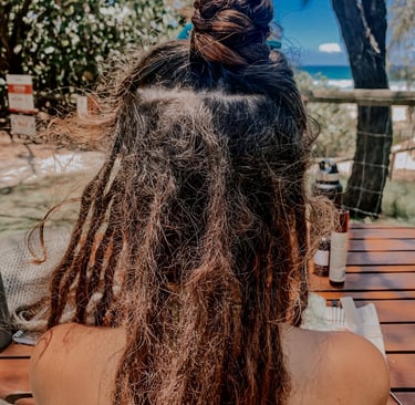 a woman with dreadlocks in her hair