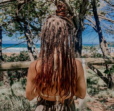 a woman with dreadlocks in her hair