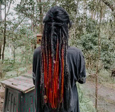 a woman with synthetic dreadlock extensions
