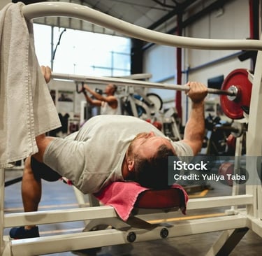 a man bench pressing some weight