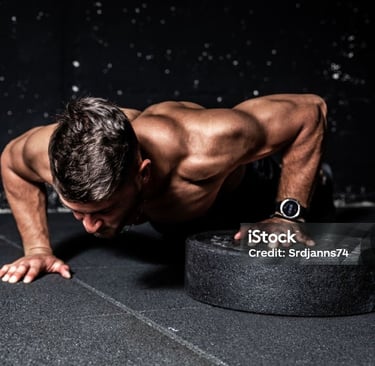 a man doing push-ups on a black background