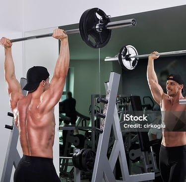 a man doing a barbell exercise in a gym