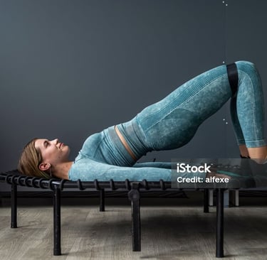 a woman doing a yoga pose on a bench