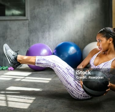 a woman doing a crunch ball exercise