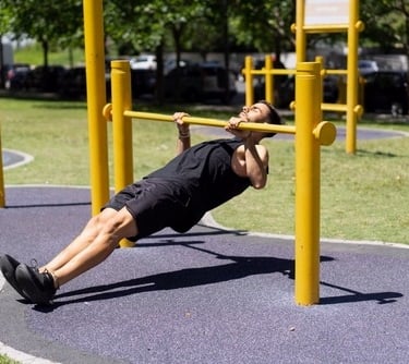 a man doing an inverted row exercise