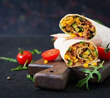a burrito with a burrito and vegetables