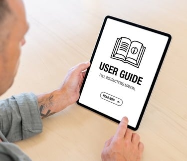 a man holding a tablet with a user's guide 