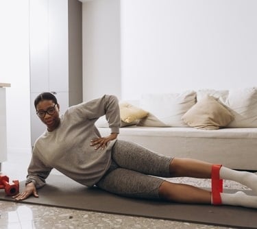 a woman in a gray sweater and red socks