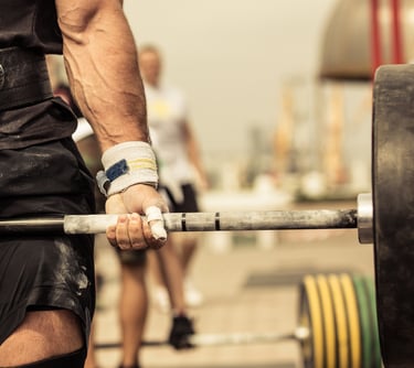 a man lifting a heavy barbell