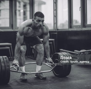 a man is squatting on a barbell