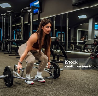 a woman using a trap bar for exercise 