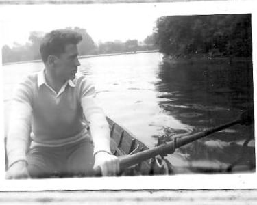 Dad rowing a small boat