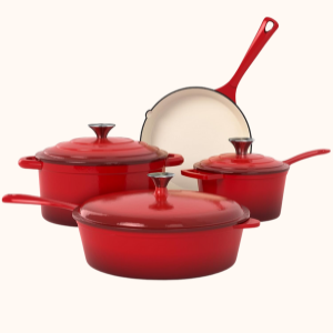 A set of vibrant red cookware includes a frying pan, saucepan, casserole dish, and stew pot, lids.