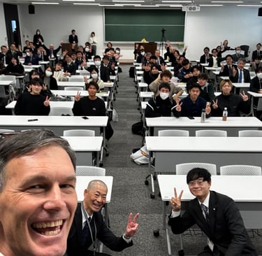 Giving a lecture on recreation to Kyushu Sangyo University
