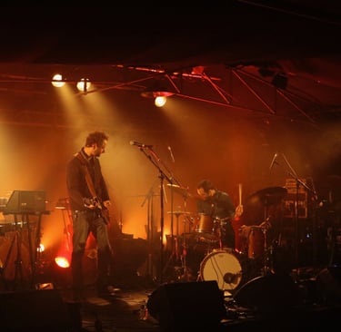 a band playing on stage with Dorian Chamoin