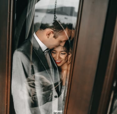 a bride and groom standing in front of a door