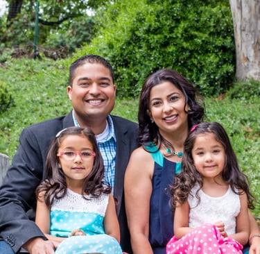 Dr Arvin Mehta and family smiling