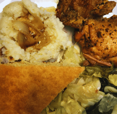baked chicken and mashed potatoes and cabbage dinner