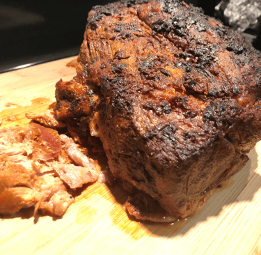 garlic citrus pork butt with crusty top and juice on bottom