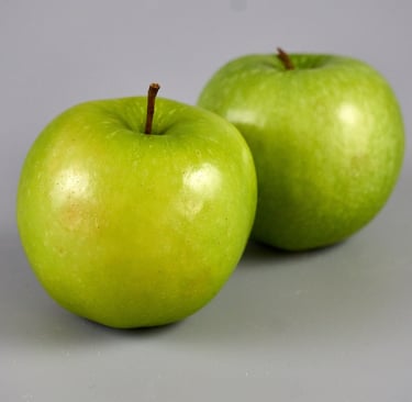granny smith apples with grey background