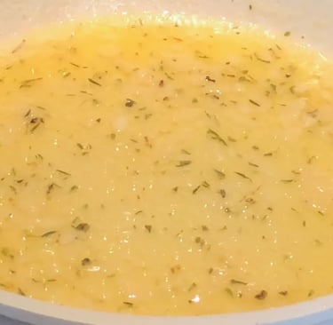 herbed lemon sauce in white saute pan