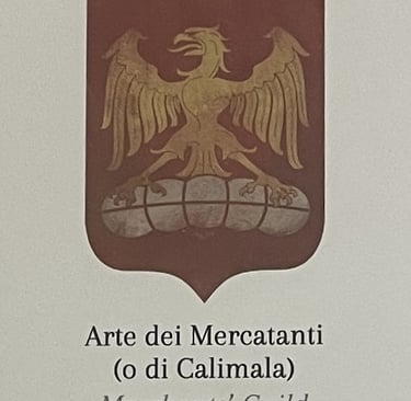 a medieval guild emblem with an eagle on a bale of cloth