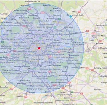 Carte montrant une zone de couverture autour de Paris avec un point central en rouge et un cercle bleu indiquant un rayon d’i