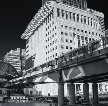 Canary Wharf buildings and DLR, London, UK, photography by Philip Preston.