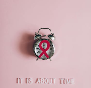 a clock with a ribbon around it and a ribbon around it. breast cancer awareness